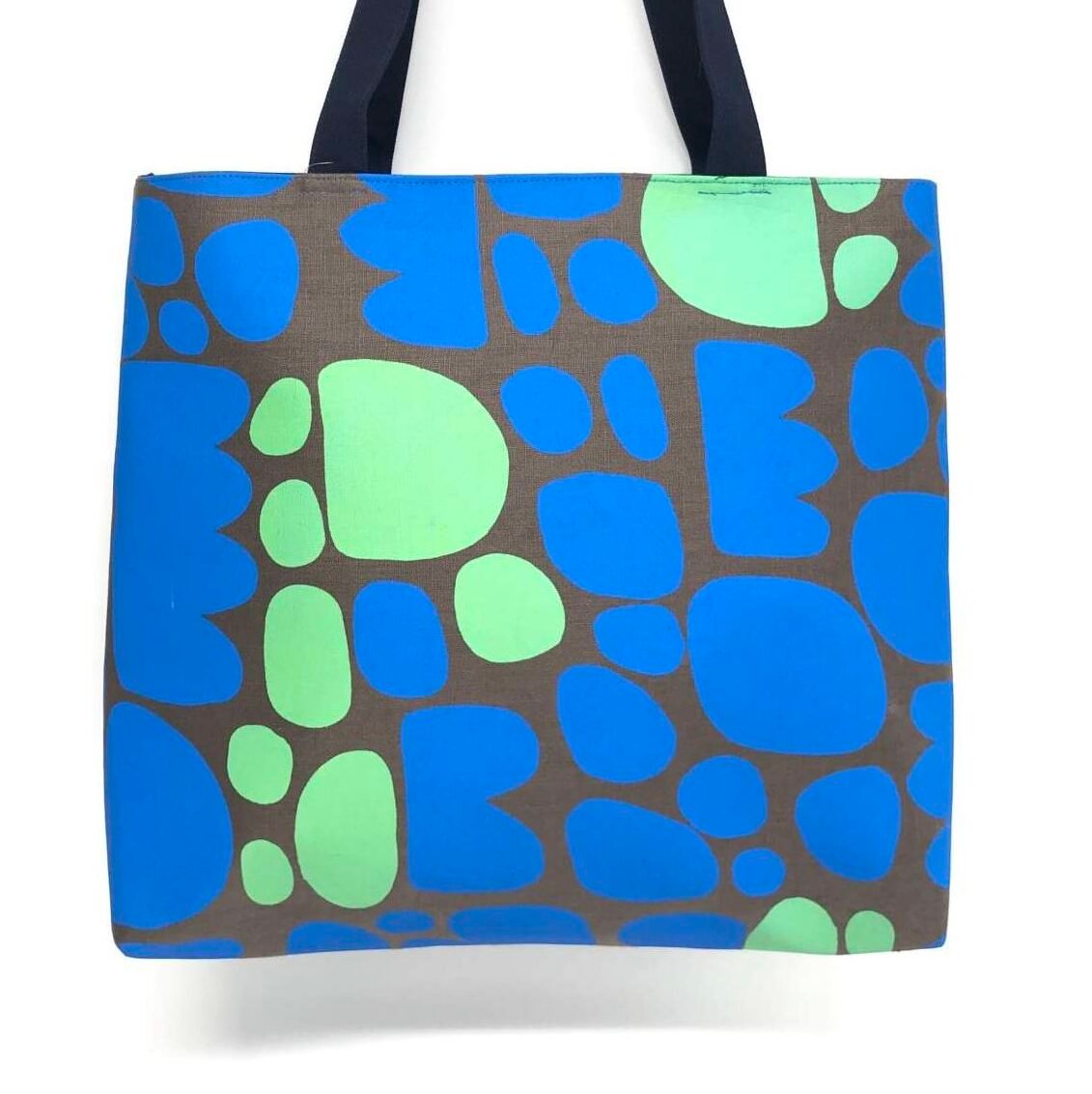 Frida bag featuring fabric designed by Keturah Zimran in Puli puli (rocks) made by Flying Fox Fabrics