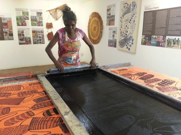 Selina Nadjown, artist, fabric designer and printer, printing Dilly Bags design at Injalak Arts 2018