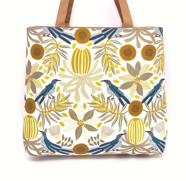 Frida tote bag in fabric designed by Jocelyn Proust with wattle birds and banksias made by Flying Fox Fabrics