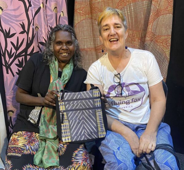 Deborah Wurrkidj of Babbarra Designs and Felicity Wright of Flying Fox Fabrics at Darwin Aboriginal Art Fair in 2023