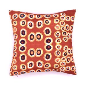 cushion cover made from Quandong fabric designed by Thomas Murray and printed in Australia. Design licensed by Papulankutja Artists to Flying Fox Fabrics